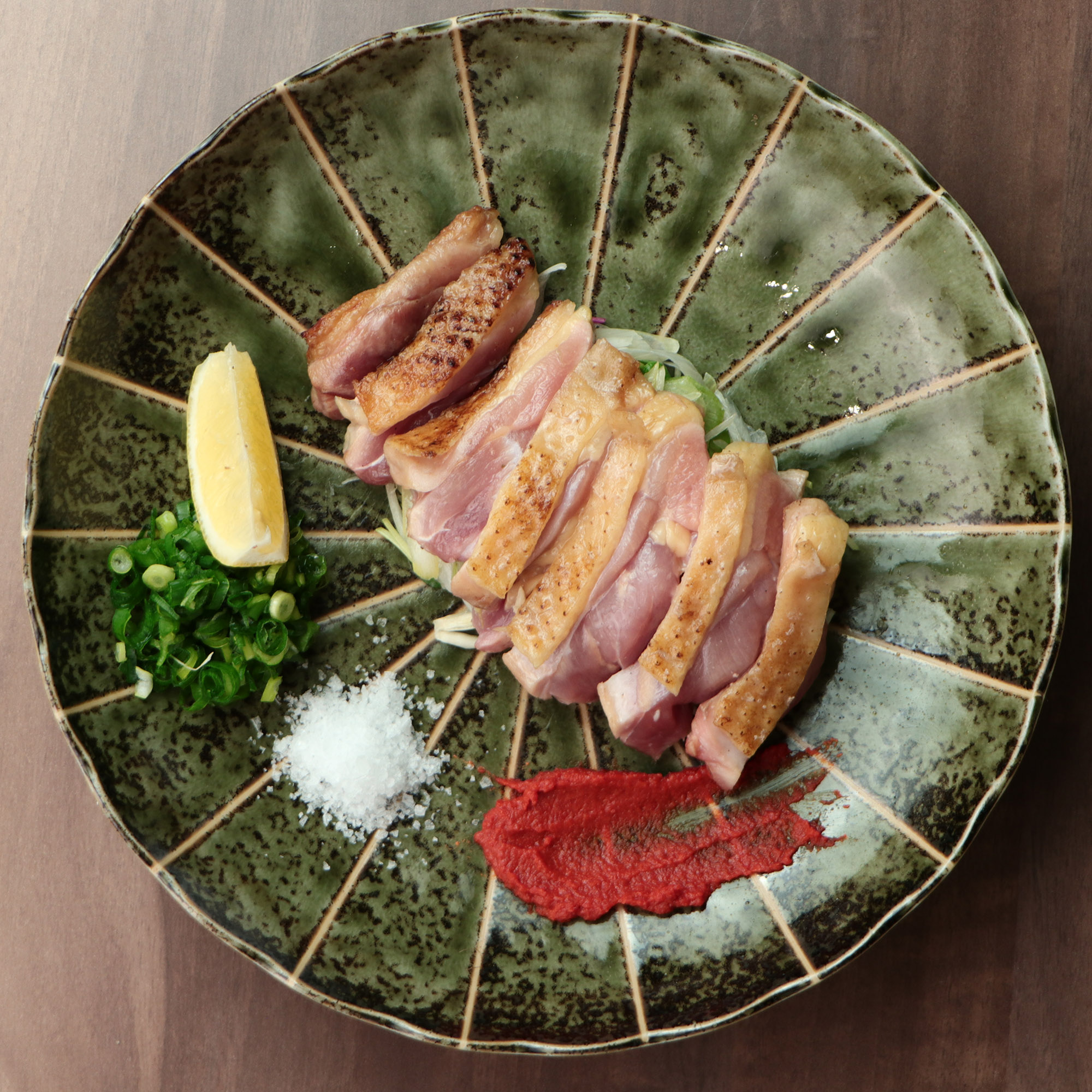 極鶏 大摩桜モモタタキ～自家製ポン酢と赤柚子胡椒～